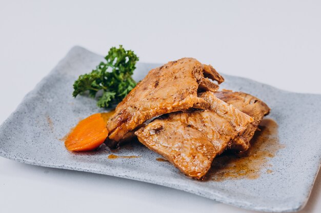 Delicious crispy fried chicken isolated on white surface