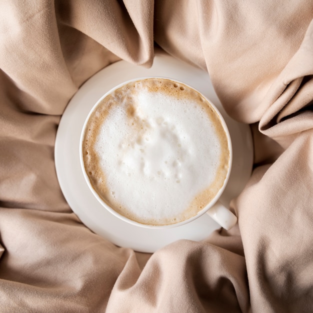 Delicious cup of coffee with whipped cream