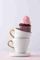 Free photo delicious cupcake and cups arrangement