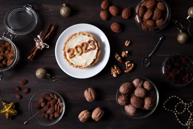 Delicious dessert for new year flat lay