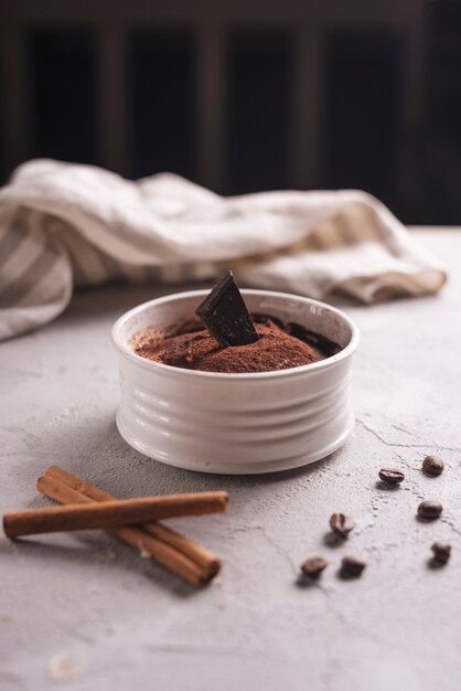 Delicious dessert with coffee beans and cinnamon