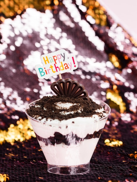 Free photo delicious dessert with happy birthday sign