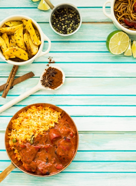 Delicious dishes and spices on table