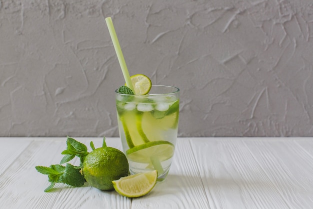 Delicious drink with lime slices