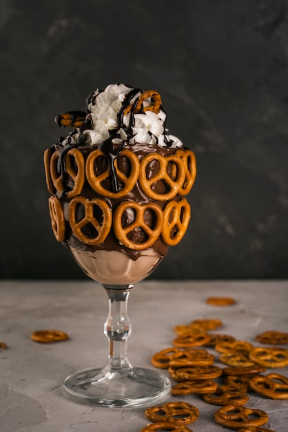 Free photo delicious drink with pretzels in a glass