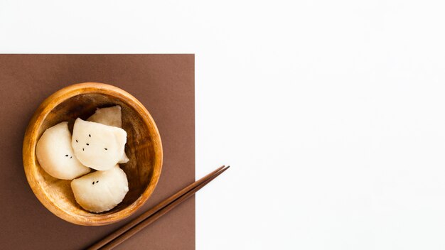 Delicious dumplings in wooden bowl