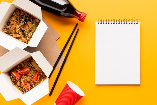 Delicious fast food boxes with clipboard