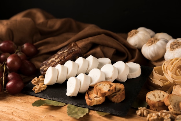 Delicious food on black slate stone