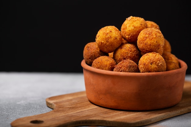 Delicious food croquettes in bowl