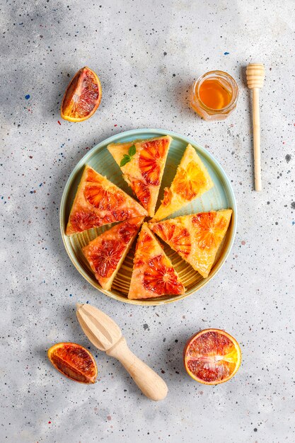 Delicious french dessert tart tatin with blood orange.