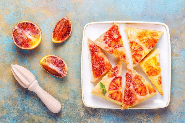 Delicious french dessert tart tatin with blood orange.