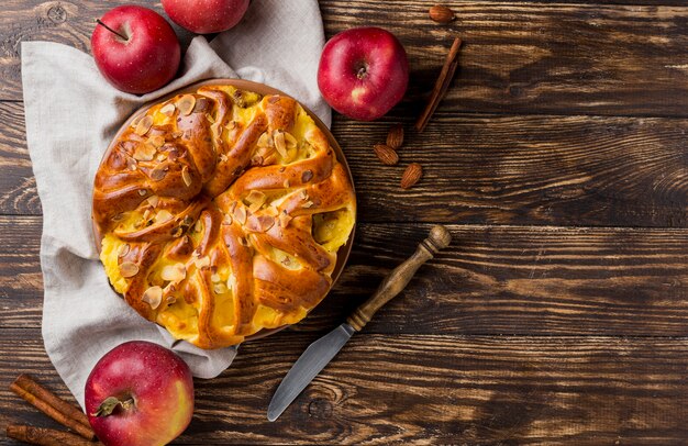 Delicious fresh apple pie on wooden background