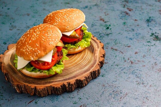 Delicious fresh homemade burgers on table