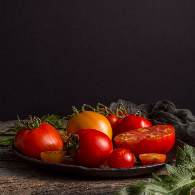 Delicious fresh tomatoes on plate