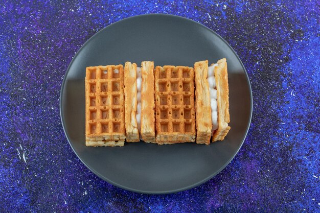 Free photo delicious fresh waffles on a colorful surface.