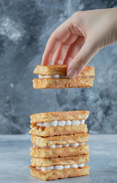 Delicious fresh waffles on a gray surface.