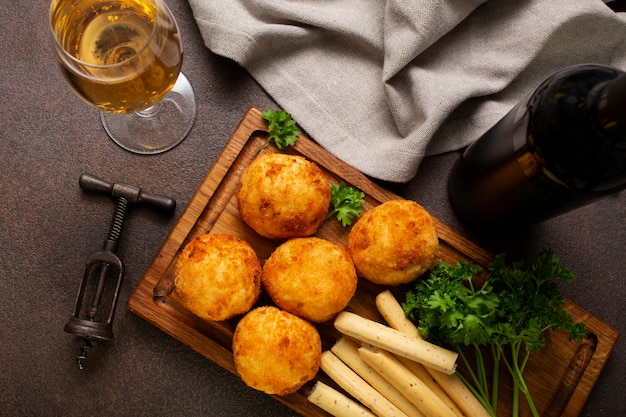 Free photo delicious fried food croquettes flat lay