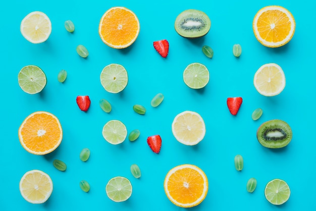 Delicious fruits on blue surface