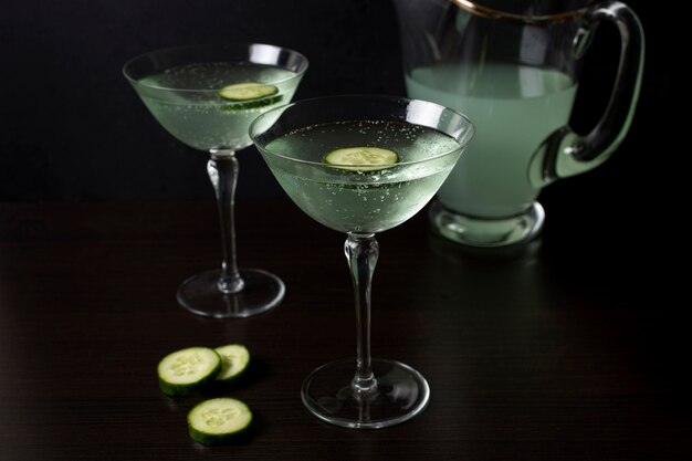 Delicious glasses of cocktail with cucumber