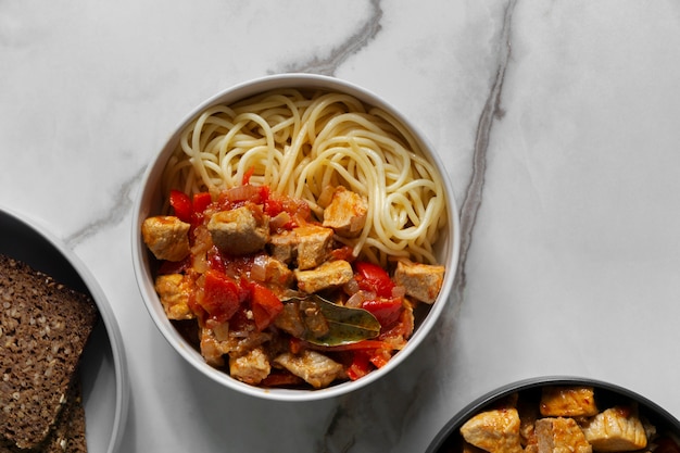 Delicious goulash and noodles flat lay