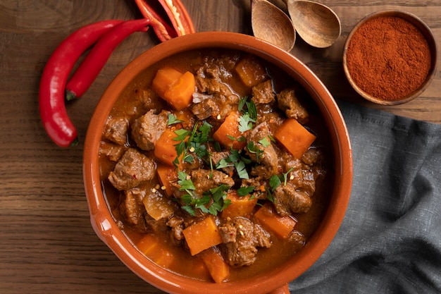 Delicious goulash stew on table