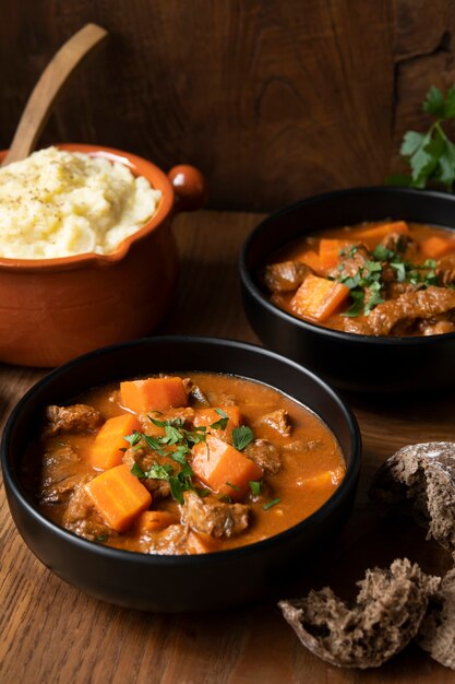 Delicious goulash stew on table