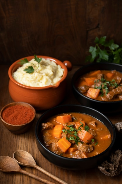 Delicious goulash stew on table