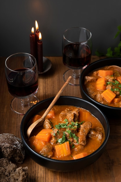 Delicious goulash stew on table