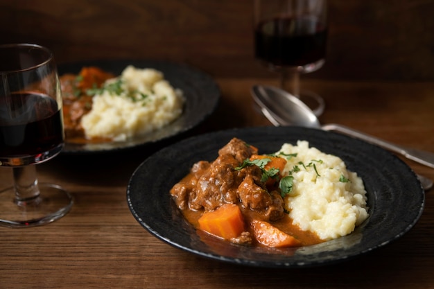 Delicious goulash stew on table