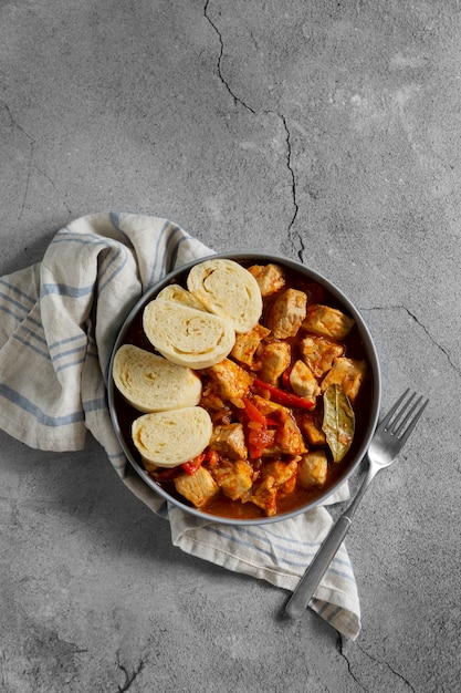 Delicious goulash with bread top view