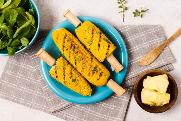 Delicious grilled corn on checkered napkin