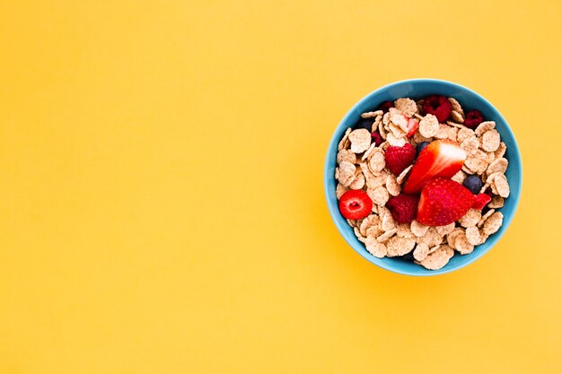 Delicious healthy breakfast on a yellow background