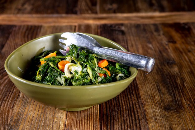 Delicious and healthy salad with tweezers