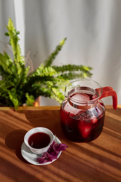 Free photo delicious hibiscus tea on table high angle