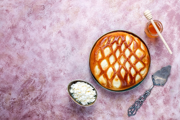 Delicious homemade cottage cheese pie tart with fresh cottage cheese and honey,top view