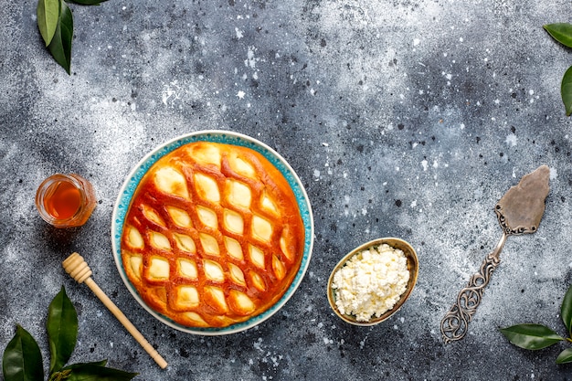 Free photo delicious homemade cottage cheese pie tart with fresh cottage cheese and honey, top view