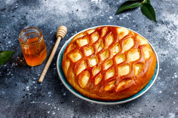 Delicious homemade cottage cheese pie tart with fresh cottage cheese and honey, top view