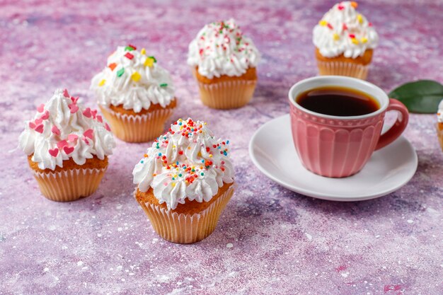 Delicious homemade cupcakes with various  sprinkles