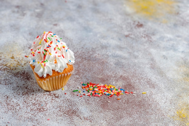 Delicious homemade cupcakes with various  sprinkles