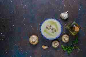 Free photo delicious homemade mushroom cream soup,top view