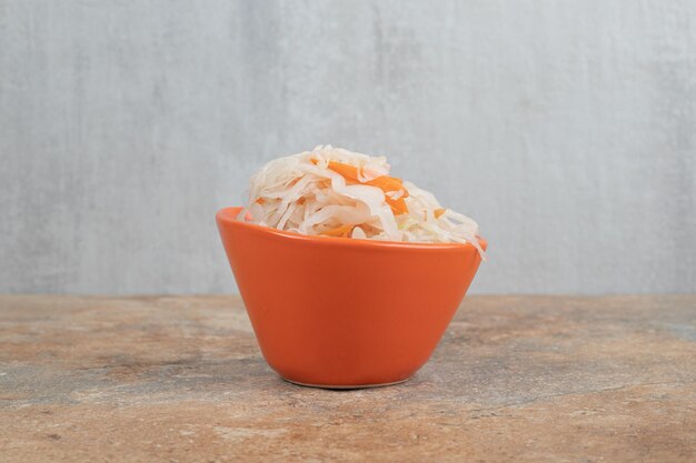 Delicious homemade sauerkraut in orange bowl