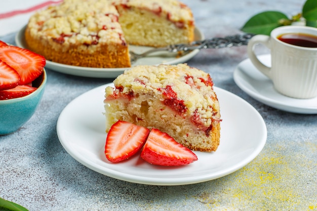 Delicious homemade strawberry crumble cake with fresh strawberry slices