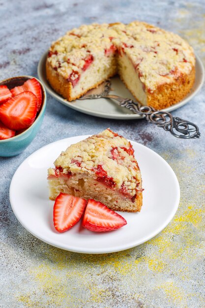 Delicious homemade strawberry crumble cake with fresh strawberry slices