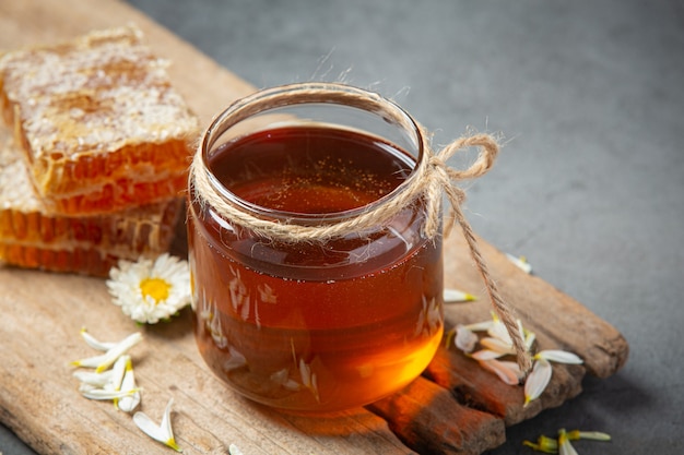 Delicious honey on dark surface