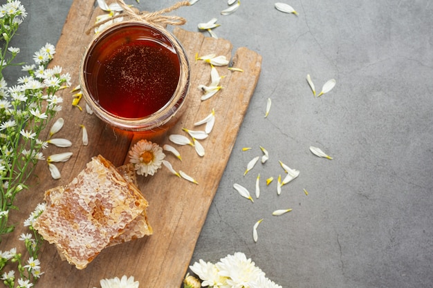 Delicious honey on dark surface