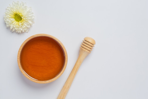 Delicious honey on white surface