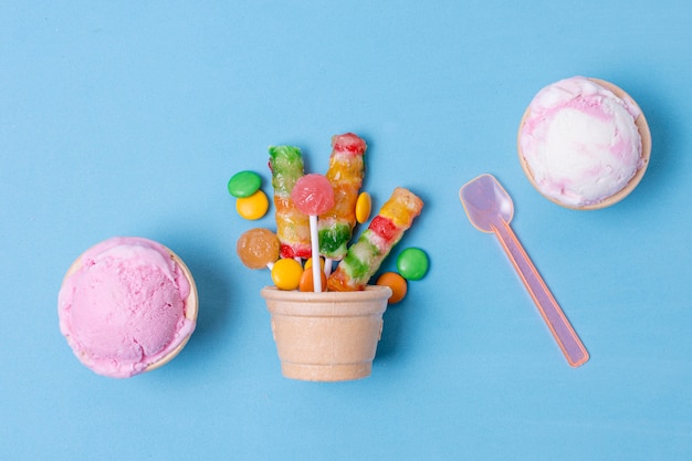 Delicious ice cream and biscuit basket with candies