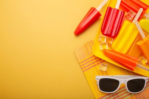 Delicious ice cream pop stickles with sunglasses