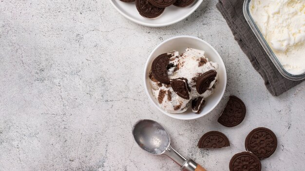 Delicious ice cream with cookies flat lay