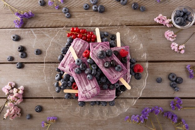 Delicious ice cream with forest fruits arrangement